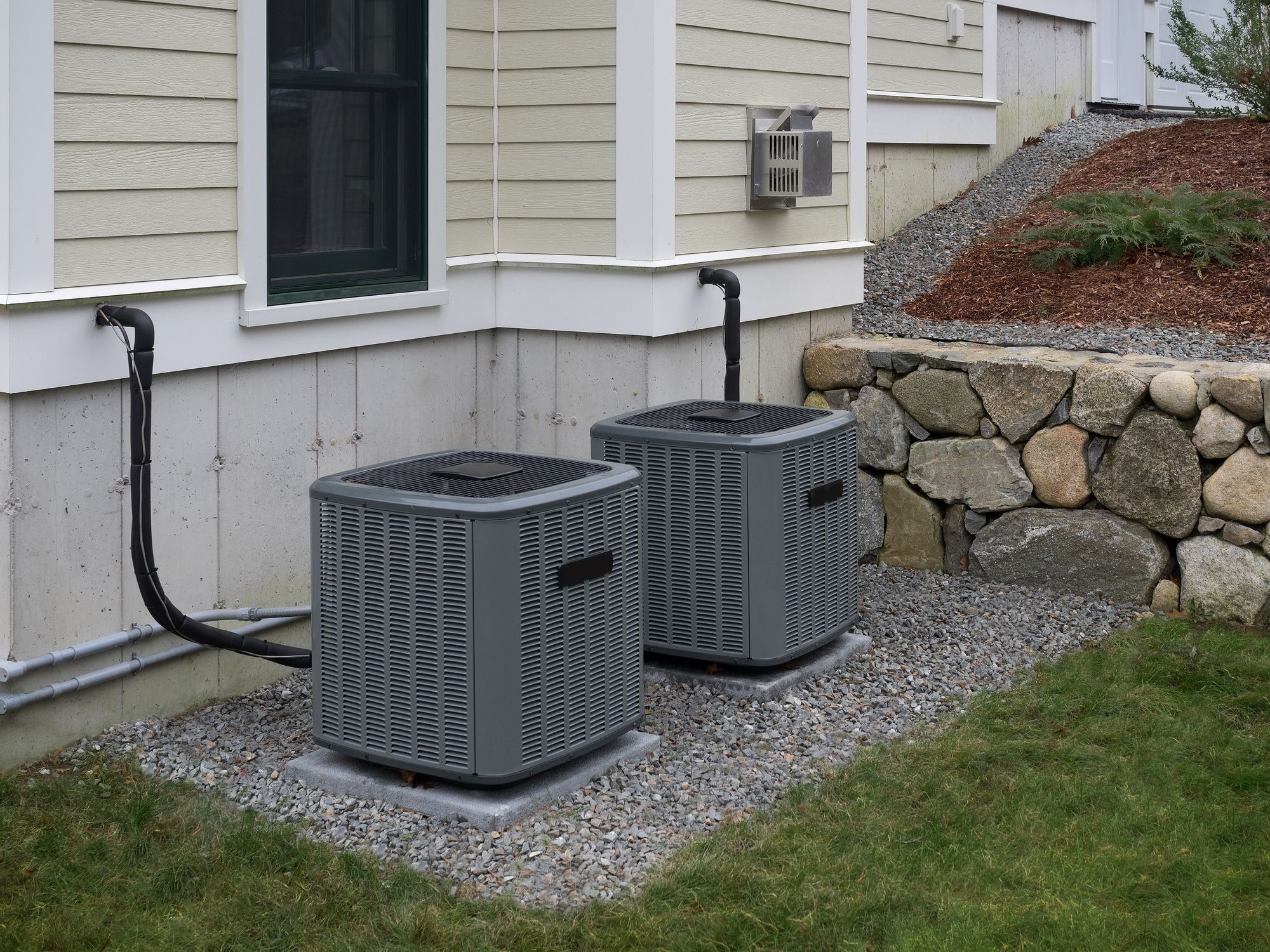 Heating and air conditioning units used to heat and cool a house sitting on a concrete slab next to a house in Mokena. Heating and air conditioning units used to heat and cool a house sitting on a concrete slab next to a house in Mokena.