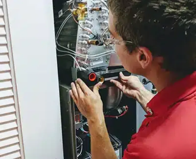 Tech performing a test on a part