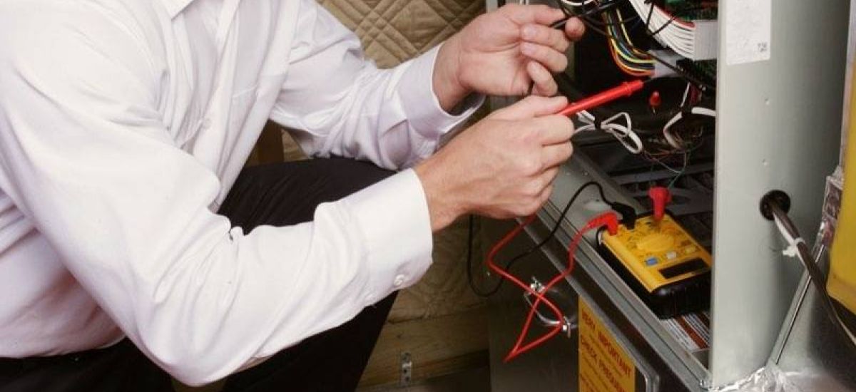 Technician repairing a furnace