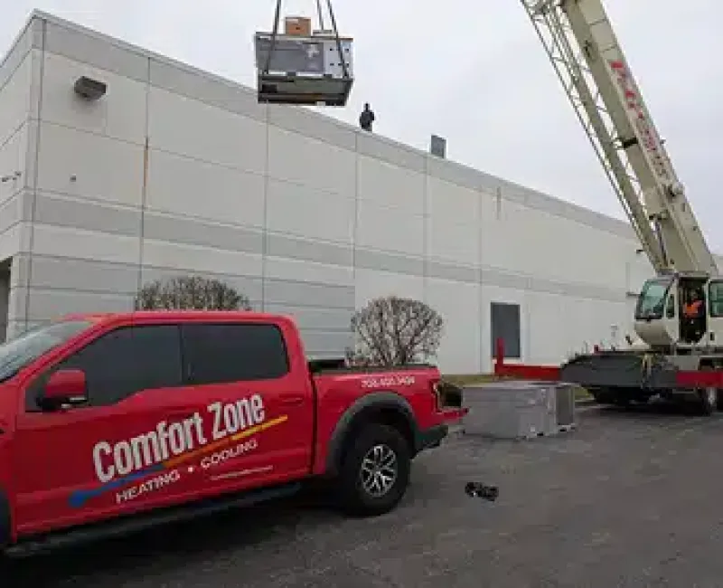 Comfort Zone truck next to crane