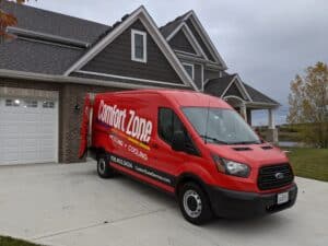 A Comfort Zone Service work van providing tankless water heater services in Mokena, IL.