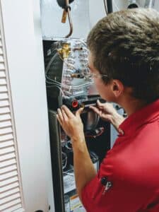 Comfort Zone Service worker providing AC maintenance services in Mokena, IL.